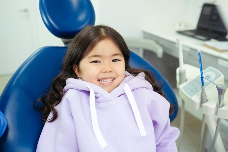 kid at dentist smiling
