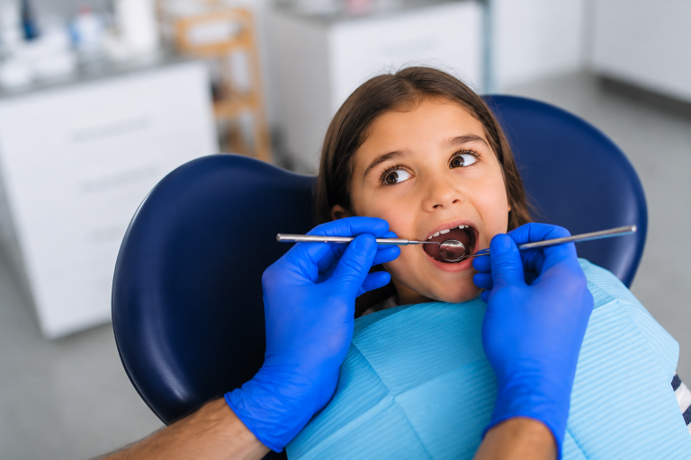 happy pediatric dental patient.png